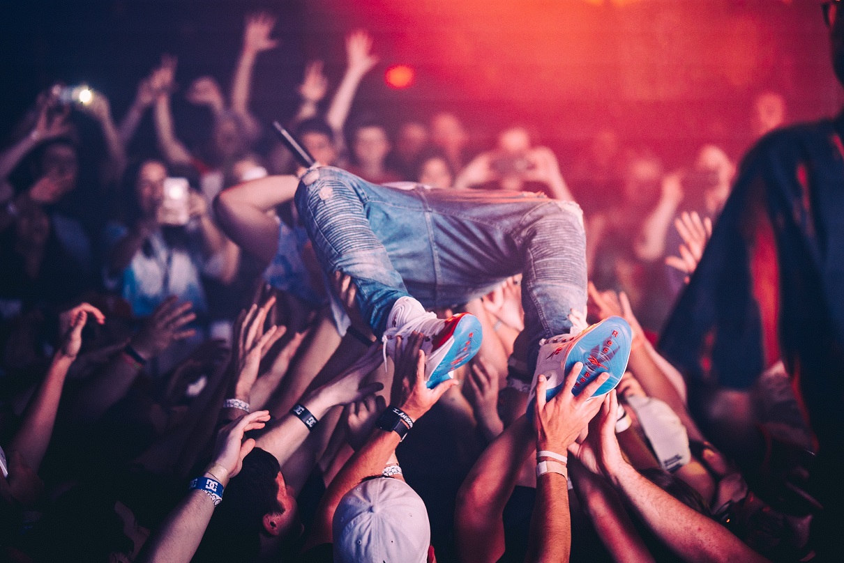 NFT, a person crowdsurfing