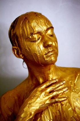 Gold, person bathed in