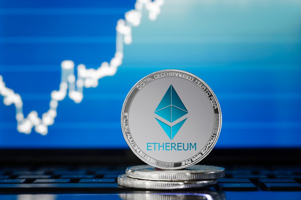 Picture of an ethereum coin with a chart behind it
