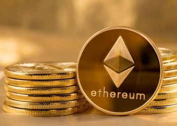 Picture of ethereum coins staked together with one coin stood next to them