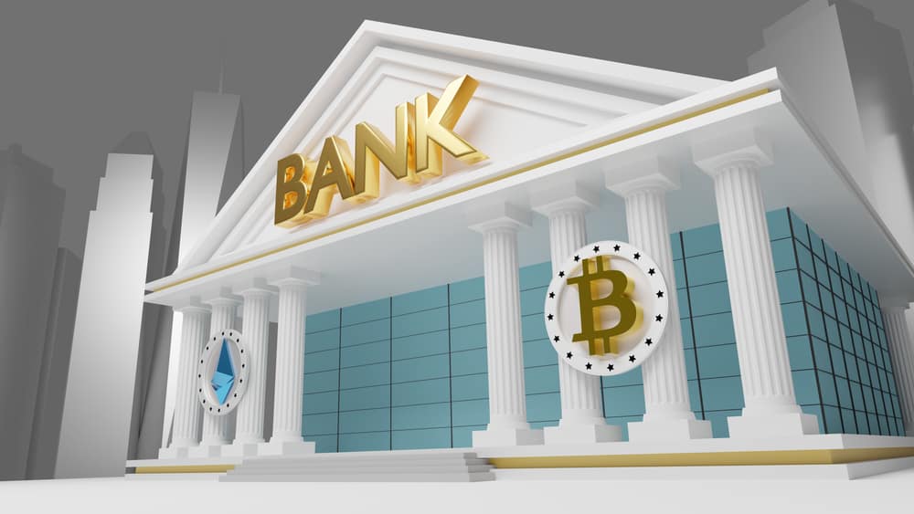Picture of a bank with a bitcoin in front of it