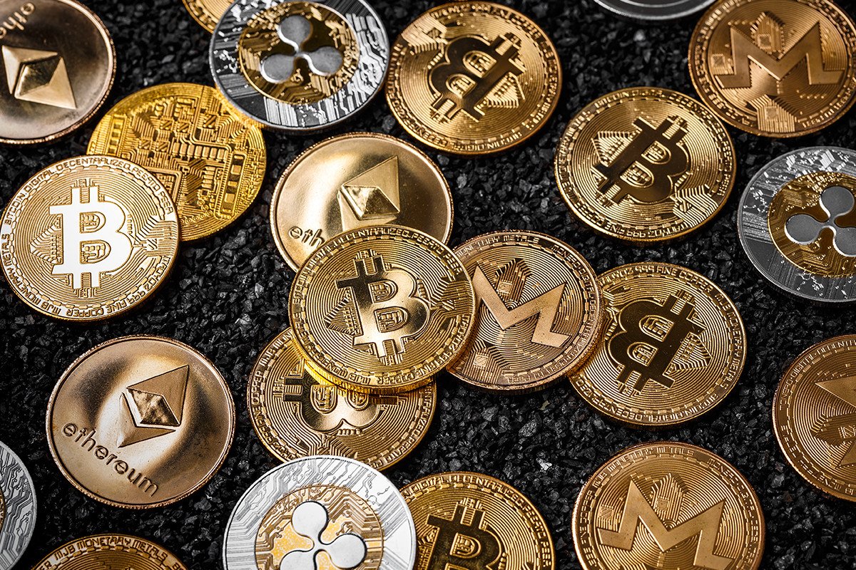 Picture of different crypto coins laying on top each other