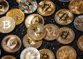 Picture of different crypto coins laying on top each other
