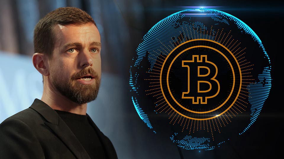 Picture of Twitter CEO Jack Dorsey with an Earth globe with a bitcoin printed on it next to him