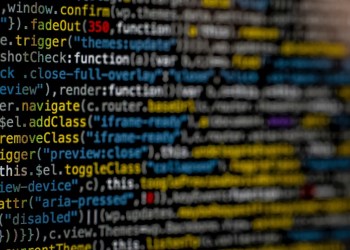 Currency, code over a black screen