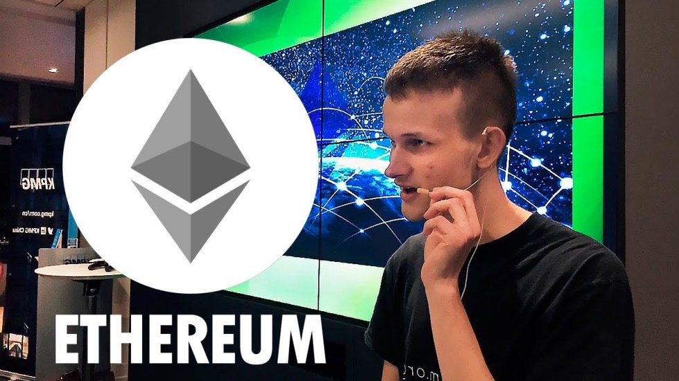 Picture of ethereum founder Vitalik Buterin with an Ethereum coin next to him