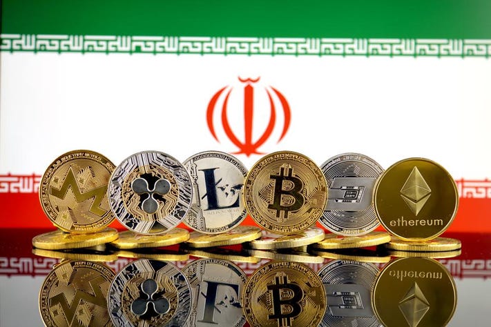 Cryptocurrency coins in front of Iran's flag