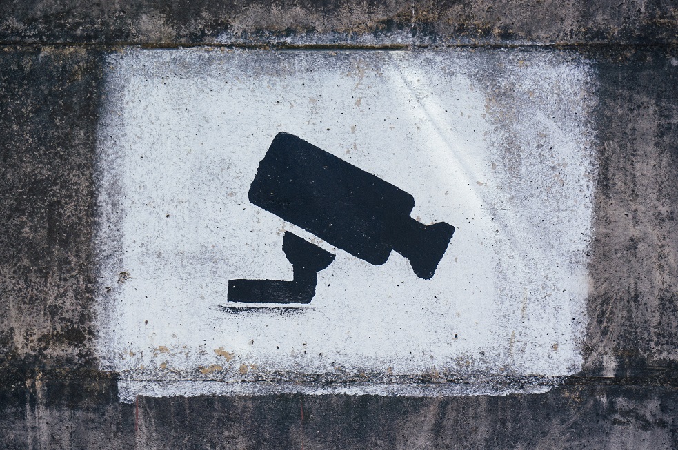 Central Bank, surveillance sign painted on a wall