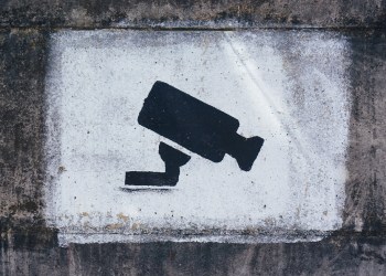Central Bank, surveillance sign painted on a wall