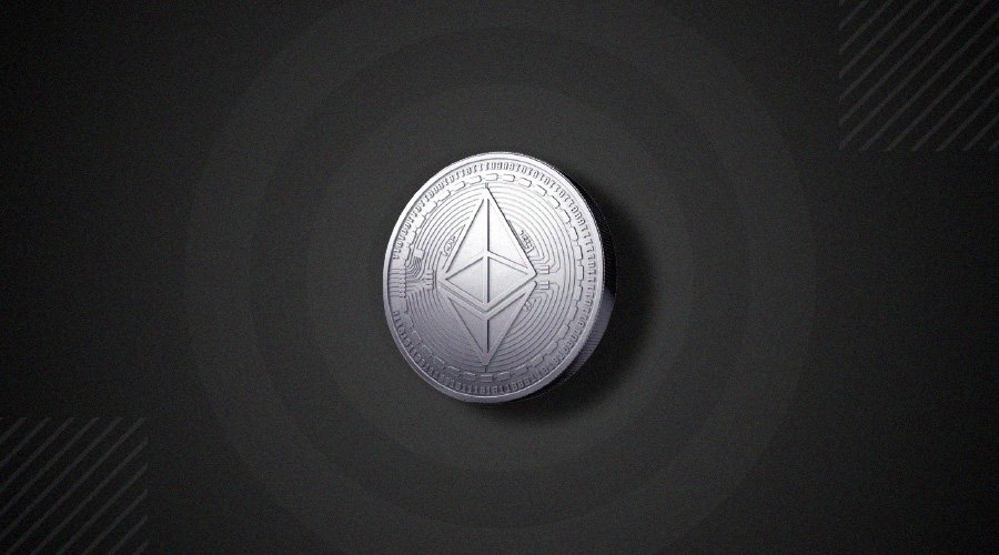 Picture of a silver Ethereum coin on a black background