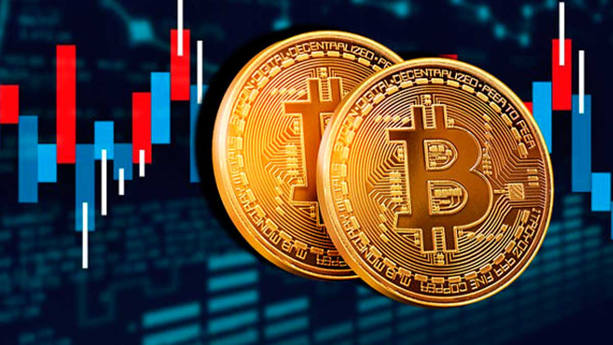 Picture of two bitcoins in front of a red and blue candlestick chart