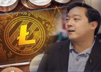 Picture of Litecoin creator Charlie Lee with a gold Litecoin next to him