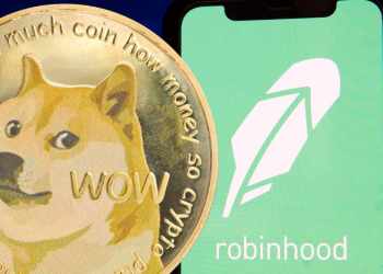 Picture of a gold Dogecoin next to a mobile phone with Robinhood app opened on it