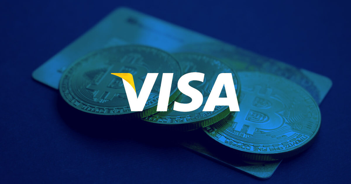 Picture of three bitcoin crypto coins on top of a credit card, with Visa written in front of it