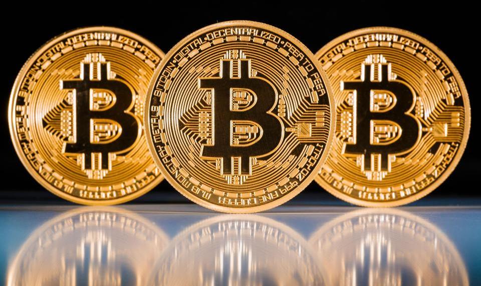 Picture of three bitcoin next to each other