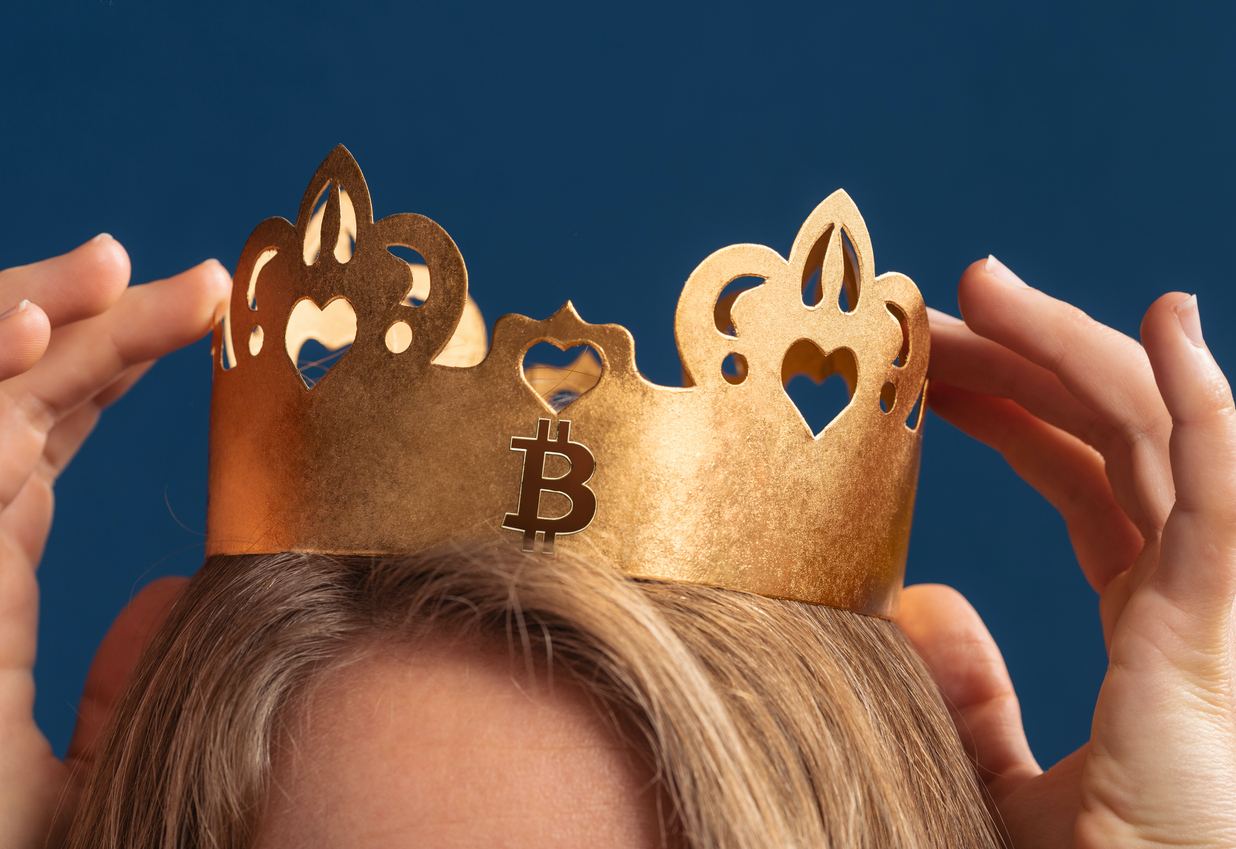 Picture of a crown atop a head with bitcoin logo on the front
