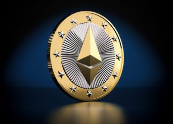 Picture of a gold and silver Ethereum coin standing on a dark blue background