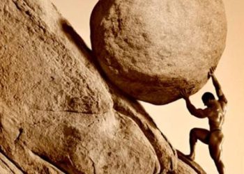 Picture of a man pushing a rock up a mountainside