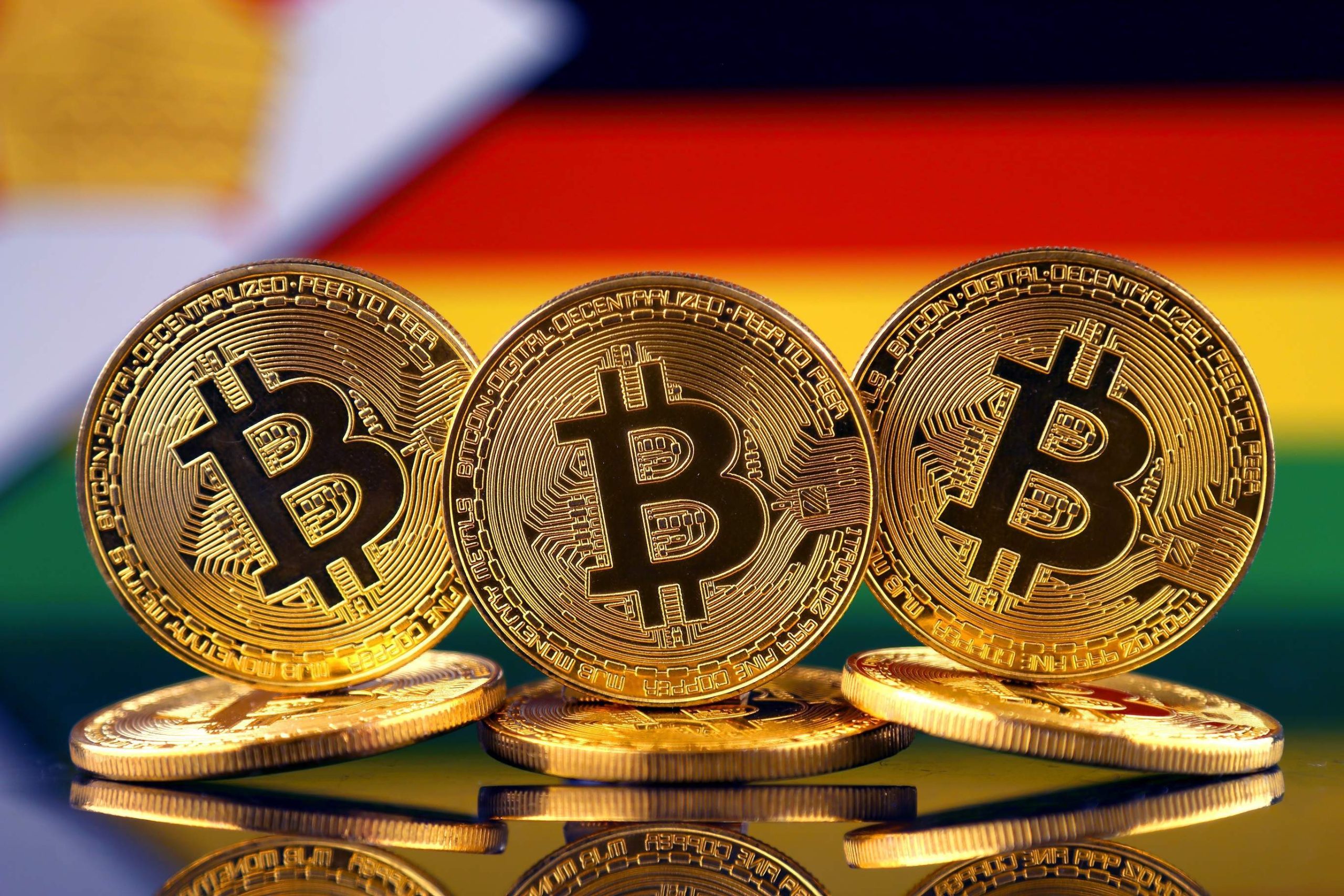 Picture of bitcoins in front of Zimbabwe flag