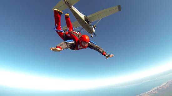 Picture of a skydiver freefalling out of a plane