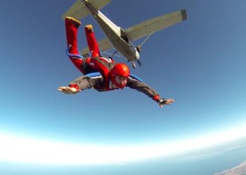Picture of a skydiver freefalling out of a plane