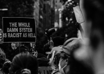 Bored Ape Yacht Club, a sign in a protest