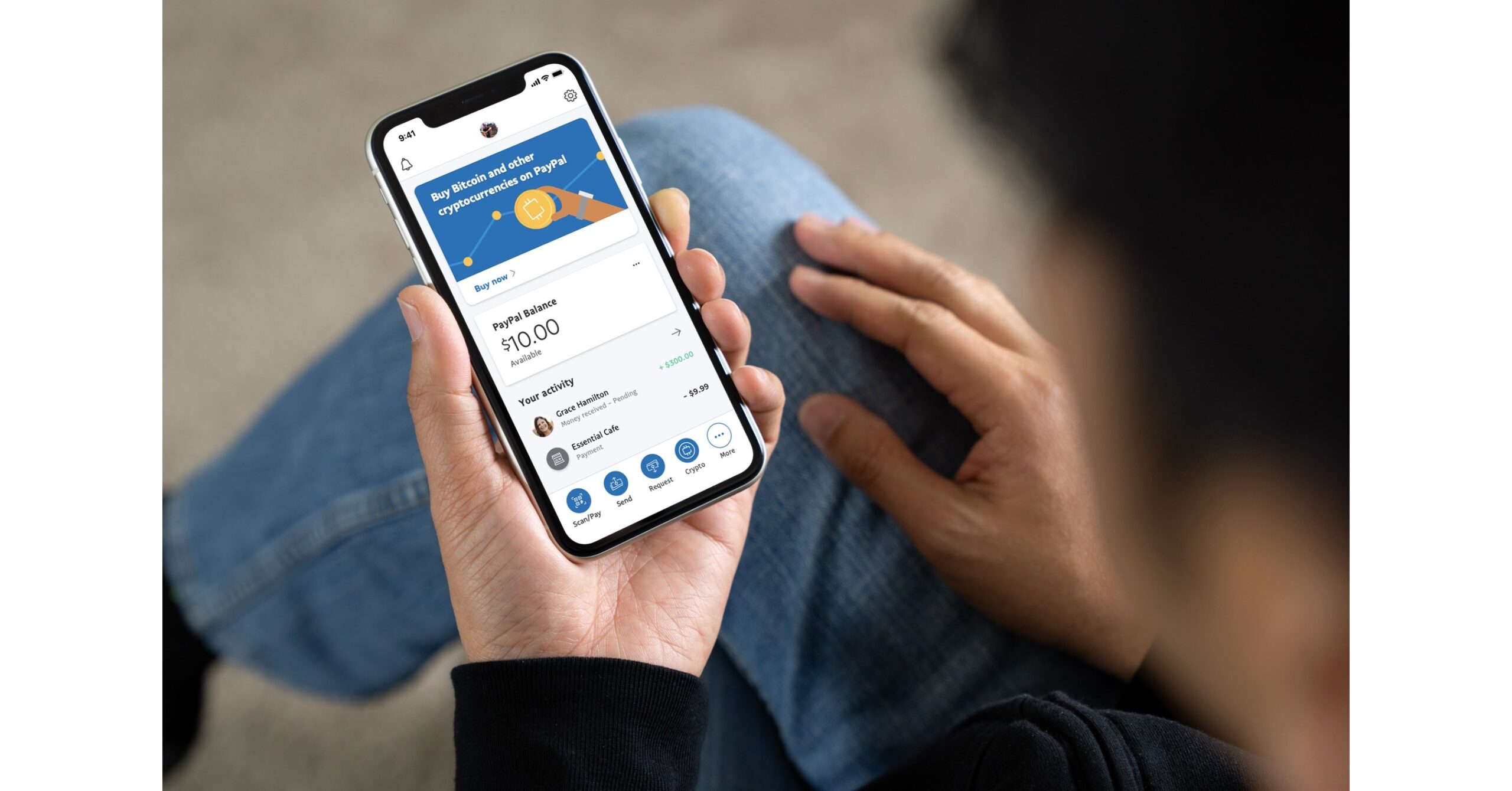 Person using PayPal crypto on phone
