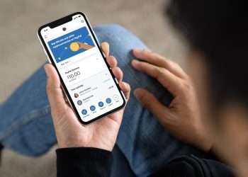 Person using PayPal crypto on phone