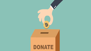 hand putting bitcoin in donation box