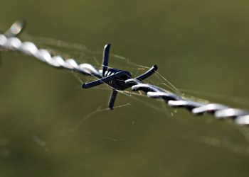 What are the major challenges hindering Decentralized Finance (DeFi) adoption in 2022?