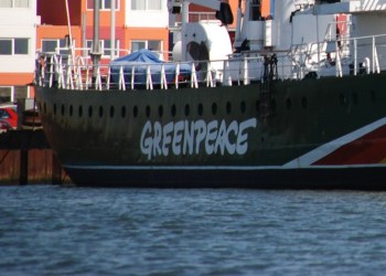 Greenpeace logo in a boat