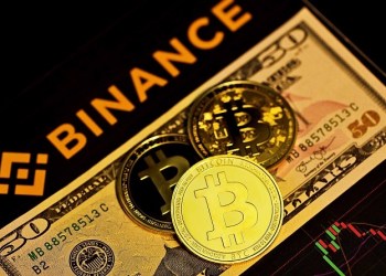 Changpeng Zhao, Binance logo and coins with bitcoin logo