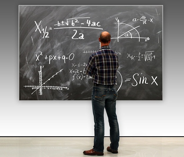 Harvard Professor in front of a blackboard