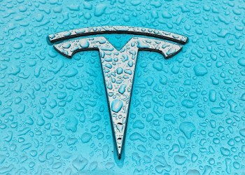 Tesla logo over cian