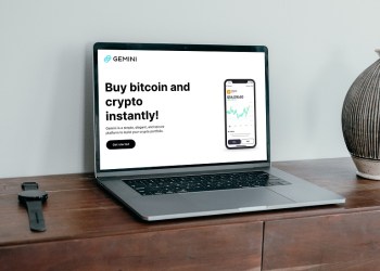 Gemini, a laptop with the website on screen