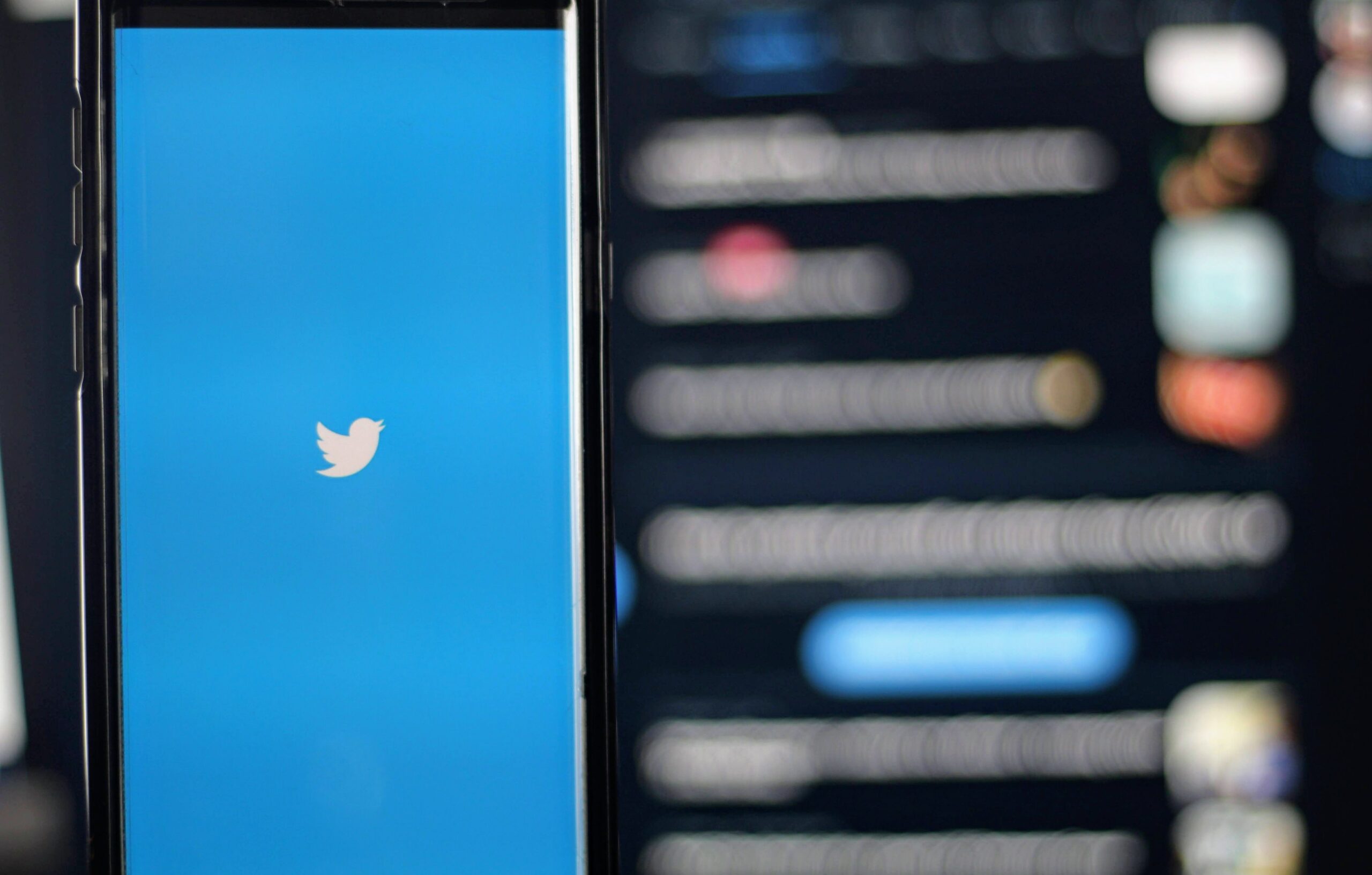 Twitter Logo on a smartphone with black background