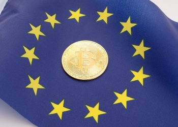 Bitcoin coin on European Union flag. Cryptocurrency on Europe