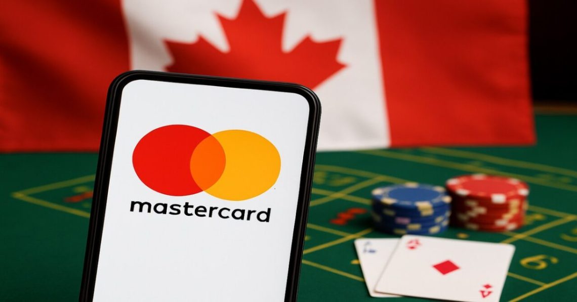A smartphone showing the Mastercard logo stands on a green casino table with poker chips and playing cards blurred in the background, while the Canadian flag hangs behind it. The scene illustrates how players can deposit at online casinos using Mastercard, emphasizing the availability of Mastercard online casinos in Canada.